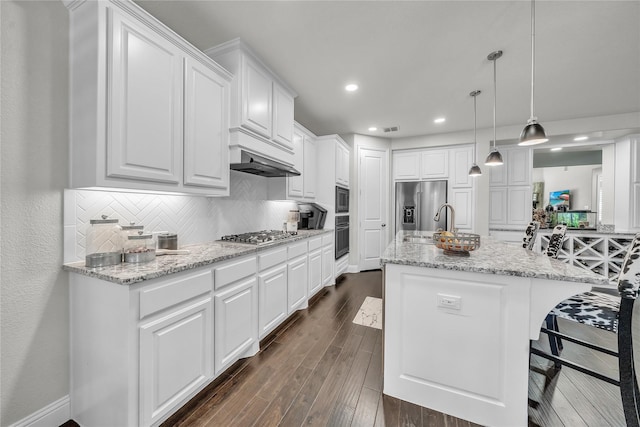 846 Underwood Ln, Celina, TX 75009 - kitchen with stainless steel appliances, white cabinetry, dark wood-style floors, range hood, and recessed lighting