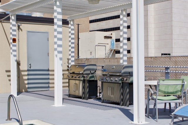 view of patio / terrace with a pergola and grilling area