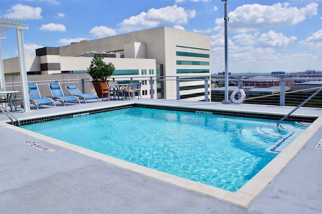 view of swimming pool with a patio