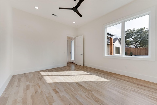10519 Somerton Dr, Dallas, TX 75229 - spare room featuring light wood-style floors, baseboards, a ceiling fan, and visible vents