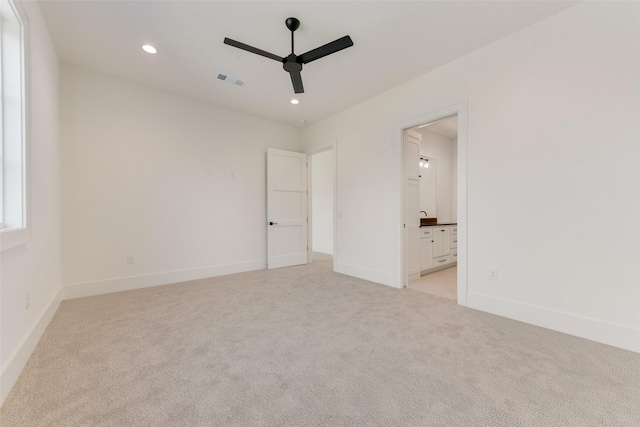10519 Somerton Dr, Dallas, TX 75229 - unfurnished bedroom featuring baseboards, visible vents, and light carpet