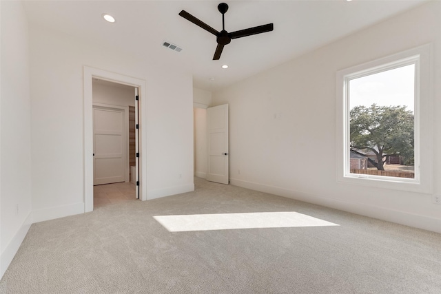 10519 Somerton Dr, Dallas, TX 75229 - unfurnished bedroom featuring recessed lighting, baseboards, light colored carpet, and visible vents