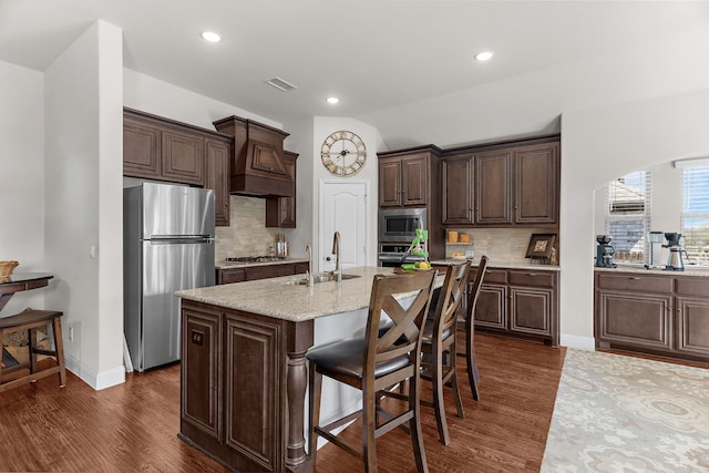 1229 Bridgeport Dr, Anna, TX 75409 - kitchen featuring appliances with stainless steel finishes, a sink, premium range hood, dark brown cabinets, and dark wood-style floors