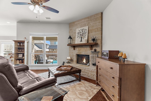 1229 Bridgeport Dr, Anna, TX 75409 - living room with a ceiling fan, wood finished floors, and a fireplace