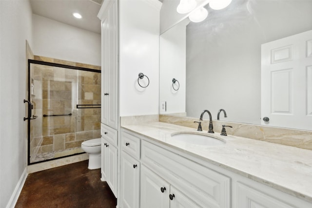 bathroom featuring baseboards, toilet, concrete flooring, a stall shower, and vanity