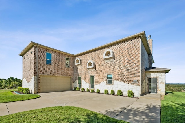 view of front of house featuring an attached garage, stone siding, and driveway