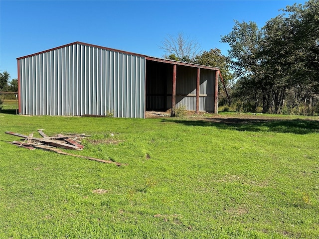 view of pole building with a lawn