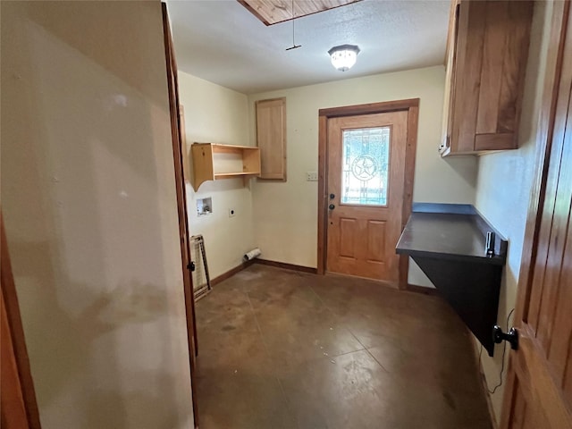 clothes washing area with baseboards, attic access, washer hookup, cabinet space, and electric dryer hookup