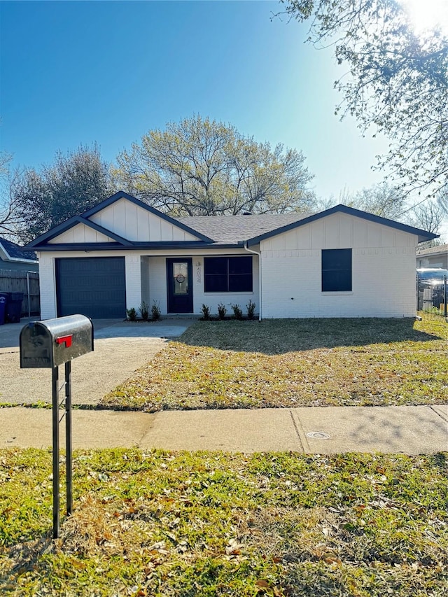 4034 Odessa St, Dallas, TX 75212 - ranch-style home featuring a garage, board and batten siding, concrete driveway, and brick siding