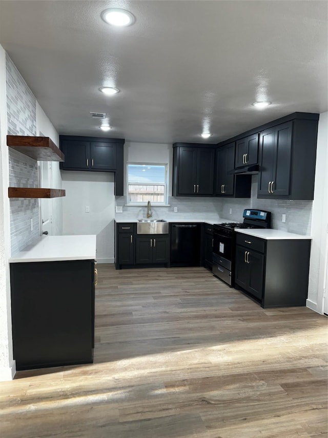 4034 Odessa St, Dallas, TX 75212 - kitchen featuring gas range oven, a sink, open shelves, dishwasher, and under cabinet range hood