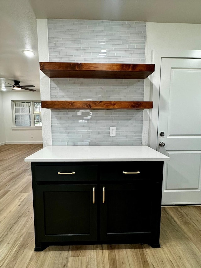 4034 Odessa St, Dallas, TX 75212 - bar with decorative backsplash, light wood finished floors, a ceiling fan, and baseboards