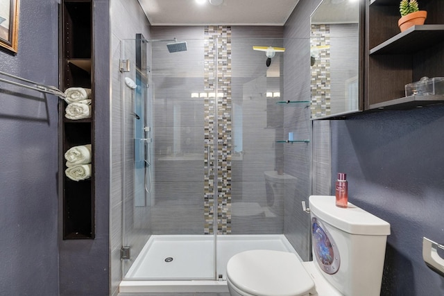 full bathroom featuring toilet and a stall shower