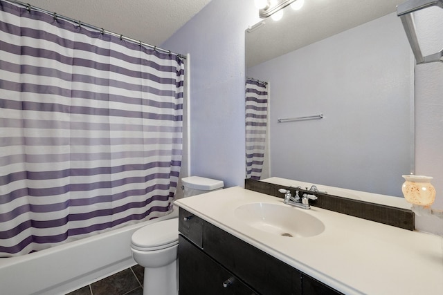 full bath featuring tile patterned floors, toilet, vanity, a textured ceiling, and shower / tub combo