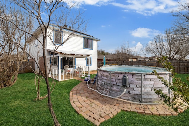 exterior space featuring a patio, a fenced in pool, and a fenced backyard