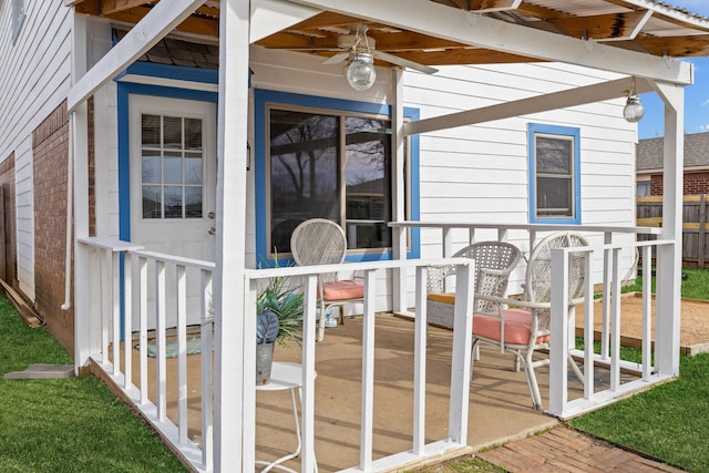 wooden terrace featuring ceiling fan