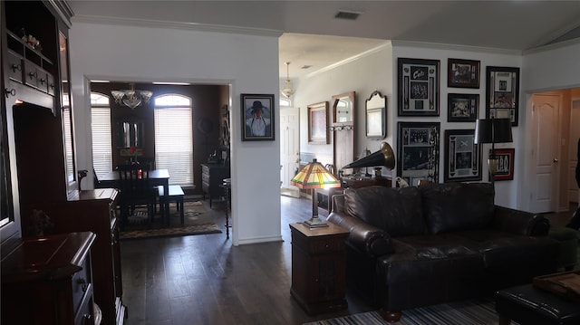 918 Wood St, Royse City, TX 75189 - living room with dark wood-type flooring, visible vents, a chandelier, and crown molding