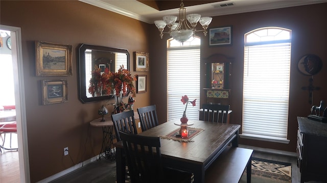 918 Wood St, Royse City, TX 75189 - dining area featuring baseboards, visible vents, crown molding, and a chandelier