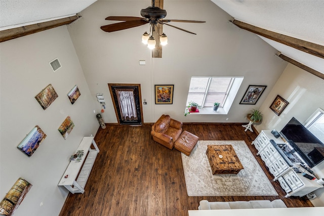 living area with visible vents, beamed ceiling, high vaulted ceiling, a ceiling fan, and wood finished floors