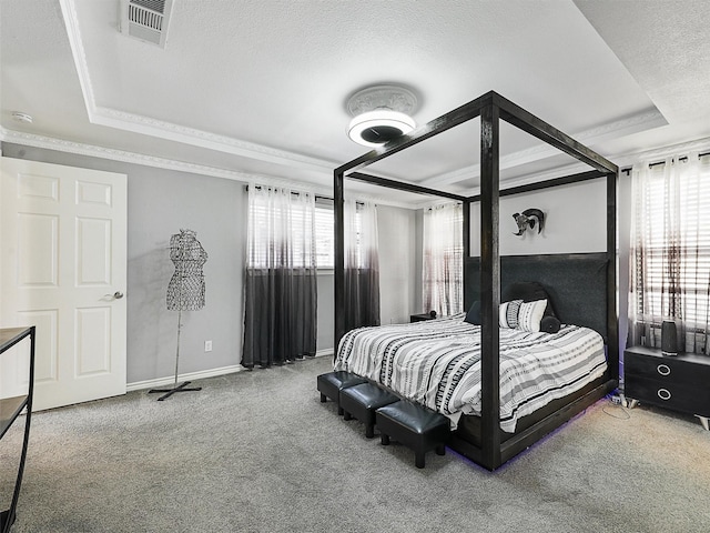 carpeted bedroom with a raised ceiling, multiple windows, crown molding, a textured ceiling, and baseboards