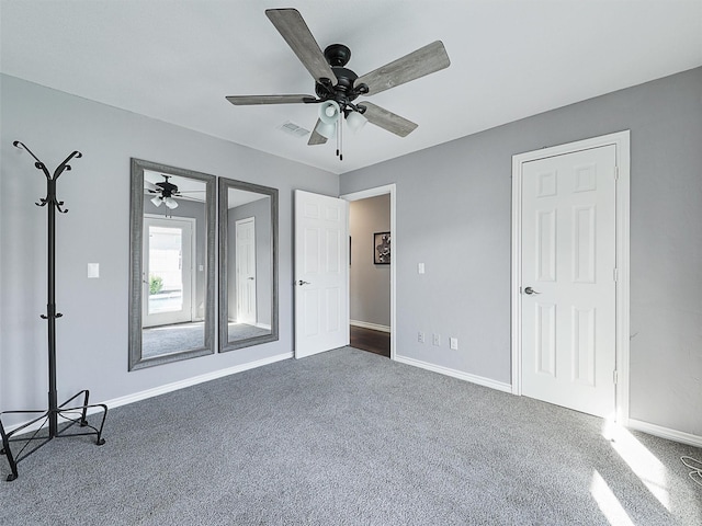 unfurnished bedroom with carpet, baseboards, and a ceiling fan