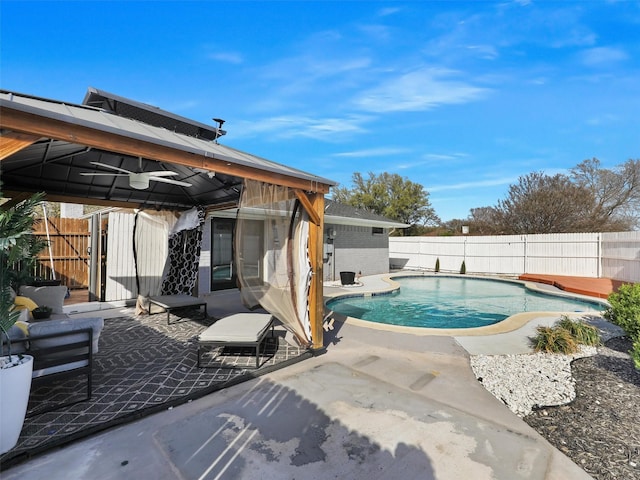 view of pool with a gazebo, a fenced backyard, and a patio