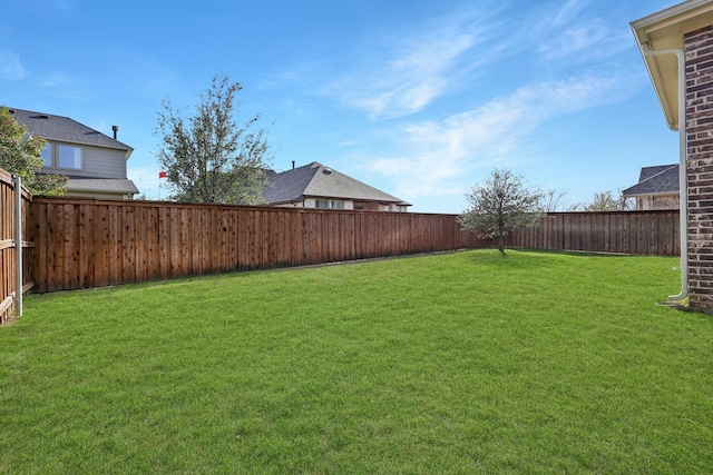 view of yard featuring a fenced backyard