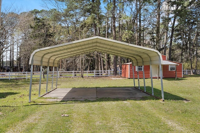 182 Kim St, Mount Vernon, TX 75457 - view of parking with fence and a carport