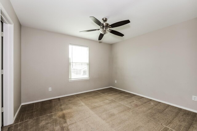 empty room with baseboards and ceiling fan