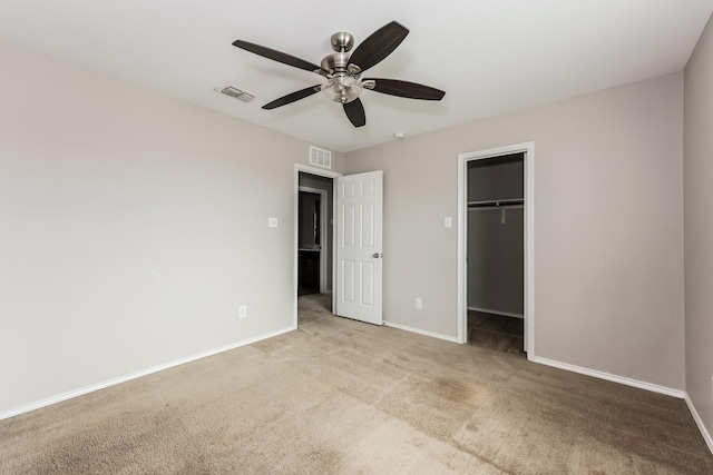 unfurnished bedroom featuring visible vents, baseboards, and carpet flooring