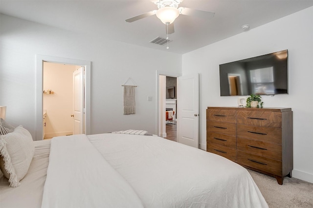 2320 Stella Ln, Northlake, TX 76247 - bedroom featuring light carpet, ceiling fan, ensuite bathroom, and baseboards