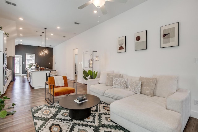 2320 Stella Ln, Northlake, TX 76247 - living room featuring wood finished floors, vaulted ceiling, recessed lighting, ceiling fan, and baseboards