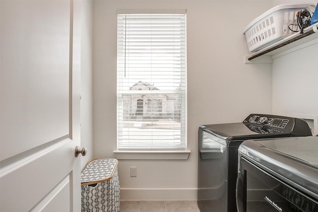 2320 Stella Ln, Northlake, TX 76247 - washroom with washing machine and clothes dryer, baseboards, and light tile patterned flooring