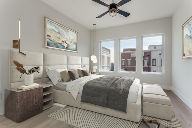 235 E Nash St Unit 113, Grapevine, TX 76051 - bedroom with a ceiling fan, wood finished floors, and baseboards