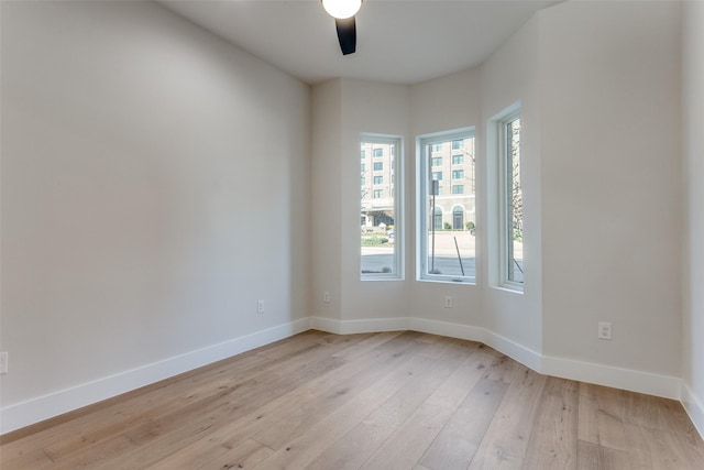 235 E Nash St Unit 113, Grapevine, TX 76051 - empty room with baseboards, a ceiling fan, and light wood-style floors