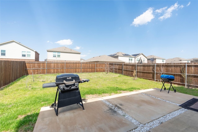 view of yard with a patio and a fenced backyard