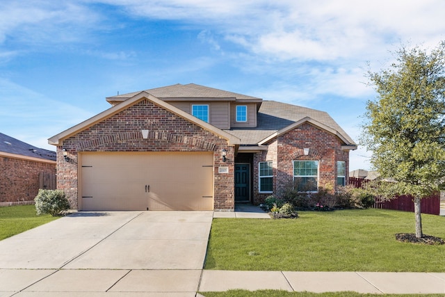 view of front facade with roof with shingles, concrete driveway, a front yard, a garage, and brick siding