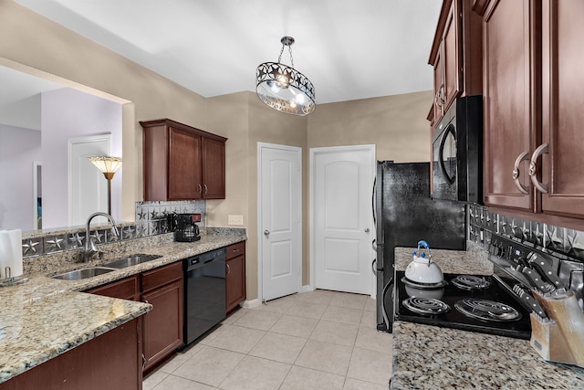 kitchen with tasteful backsplash, light stone countertops, light tile patterned flooring, black appliances, and a sink
