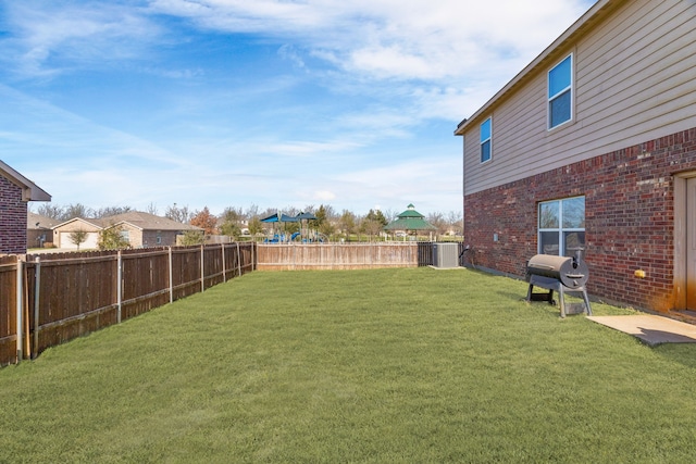 view of yard featuring cooling unit and a fenced backyard