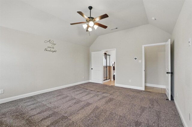 unfurnished bedroom featuring ceiling fan, light colored carpet, visible vents, baseboards, and lofted ceiling