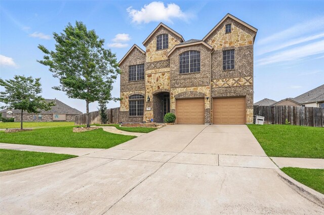 entrance to property with fence, brick siding, a garage, stone siding, and concrete driveway