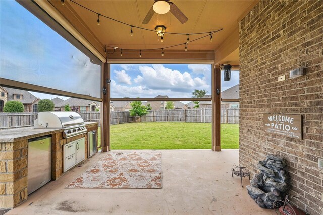 view of patio / terrace with a fenced backyard, a ceiling fan, area for grilling, and a grill