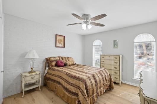 bedroom featuring light wood finished floors and ceiling fan