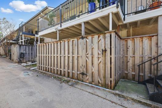 view of side of home with a balcony
