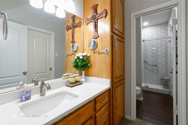 1426 Lakeview Rd, Abilene, TX 79602 - full bathroom with toilet, a shower stall, wood finished floors, and vanity