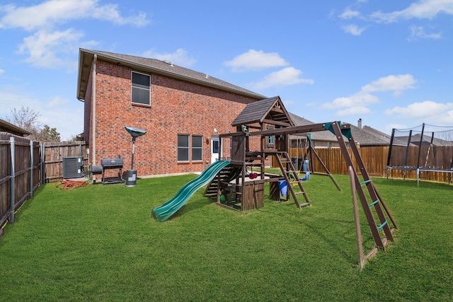 2408 Clairborne Dr, Fort Worth, TX 76177 - back of property featuring a playground, a trampoline, brick siding, and a fenced backyard