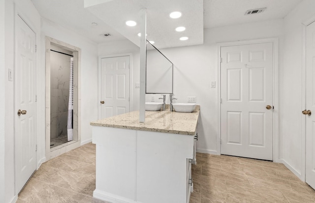 3005 Club Hill Dr, Garland, TX 75043 - bathroom with a sink, visible vents, double vanity, and a shower stall
