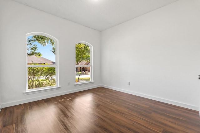 3005 Club Hill Dr, Garland, TX 75043 - empty room featuring baseboards and dark wood-style floors