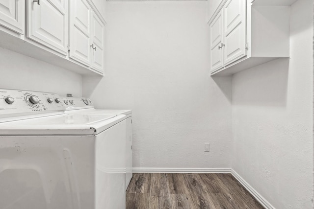 3005 Club Hill Dr, Garland, TX 75043 - washroom featuring washer and clothes dryer, cabinet space, baseboards, dark wood-style flooring, and a textured wall
