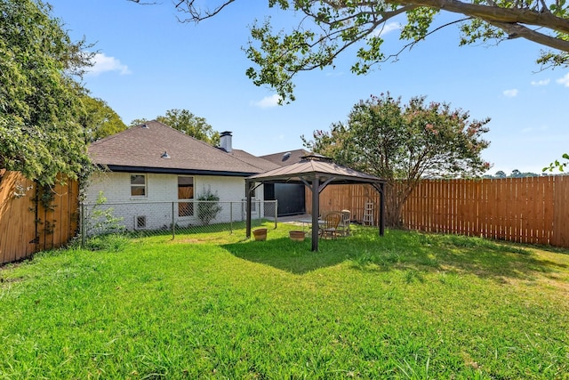 3005 Club Hill Dr, Garland, TX 75043 - back of property with brick siding, roof with shingles, a gazebo, a lawn, and a fenced backyard