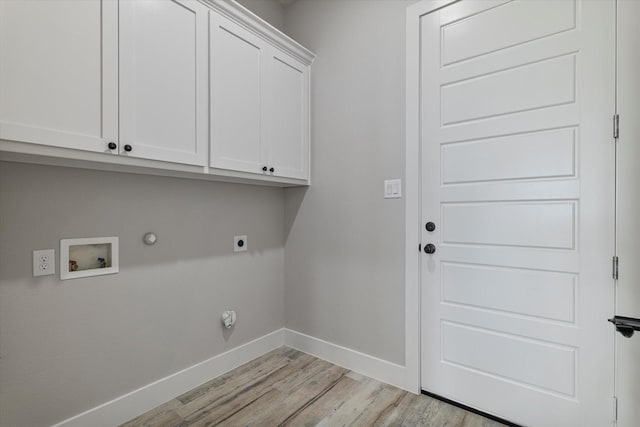 clothes washing area with washer hookup, hookup for a gas dryer, cabinet space, baseboards, and hookup for an electric dryer